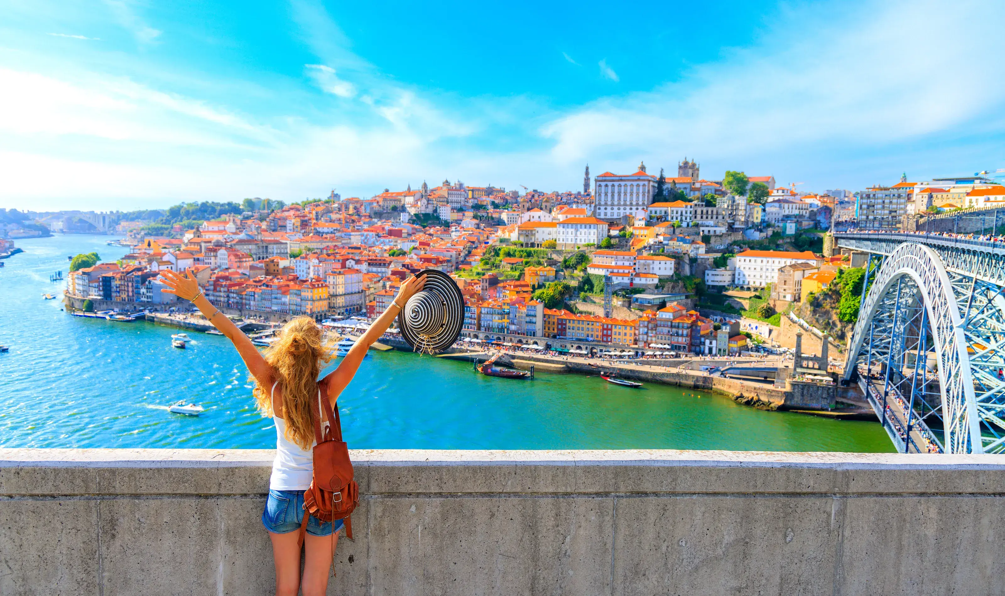 Happy traveler woman in Porto - Cityscape panoramic view of Porto - Portugal